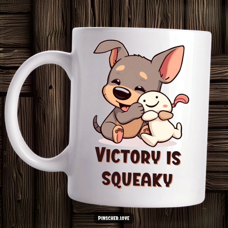 Funny Pinscher Mug: A dog playfully wrestles a squeaky toy with pure, comical enthusiasm and joyful abandon.
