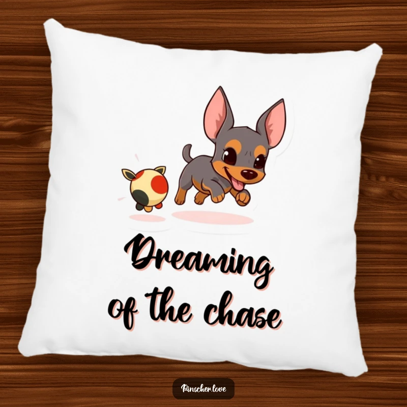 Funny pillow depicting an energetic pinscher character focused on chasing a small, fleeing toy.