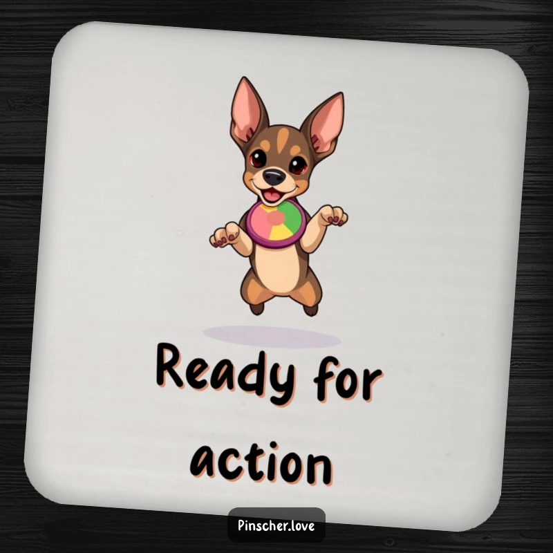 Funny Pinscher coaster depicting a determined dog poised to leap for a colorful flying disc, adding sporty humor.