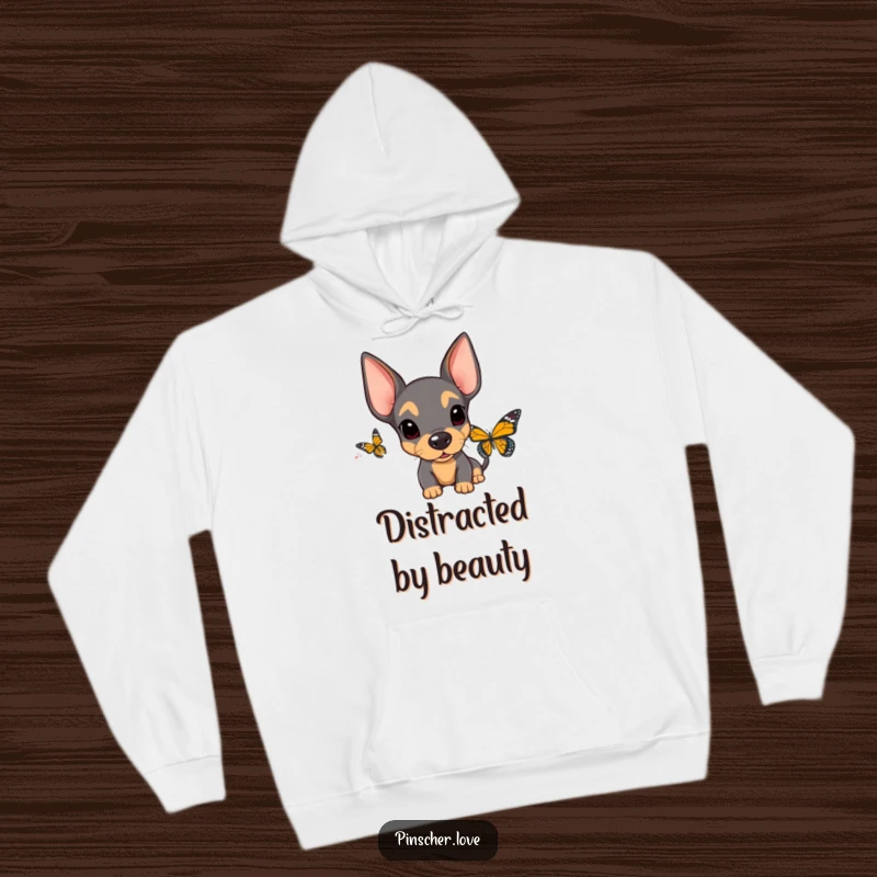 Funny Surprised Pinscher Hoodie: A soft hoodie showcases a pinscher's comical surprise, floppy ears askew, at the sight of a butterfly.