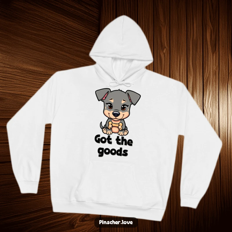 Funny Pinscher Hoodie: A dog with a mischievous glint holds a tiny bone, exuding playful secrets and charm.