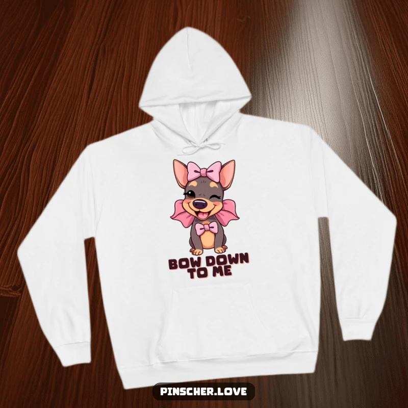 Funny Pinscher Hoodie: A delighted pinscher proudly wears an enormous, floppy bow and gives a charming wink, exuding confidence and humor.