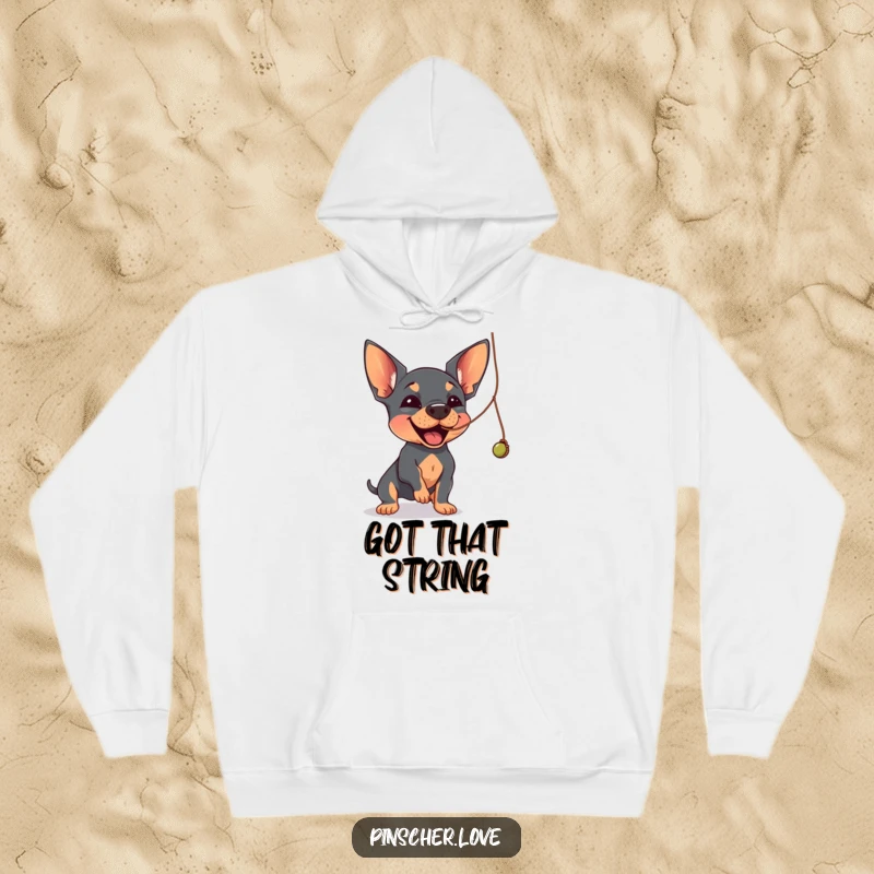 Funny Pinscher hoodie showing a Pinscher dog joyfully batting at a dangling, wobbly string.