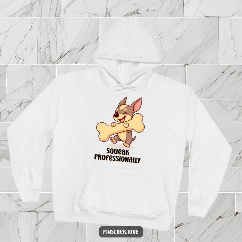 Funny Pinscher dog hoodie, energetically bouncing a huge squeaky toy bone, radiating happiness and playful spirit.