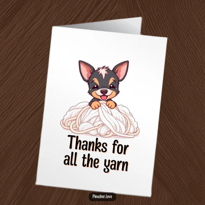 Funny Free Printable Thank You Card: A happy Pinscher buried in a soft, fluffy yarn stash, expressing thanks.