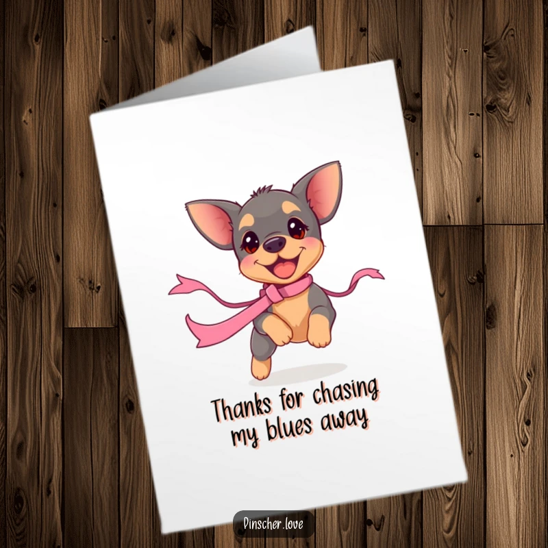 Funny Free Printable Thank You Card: A small pinscher puppy enthusiastically chasing a wavy ribbon, conveying thanks.