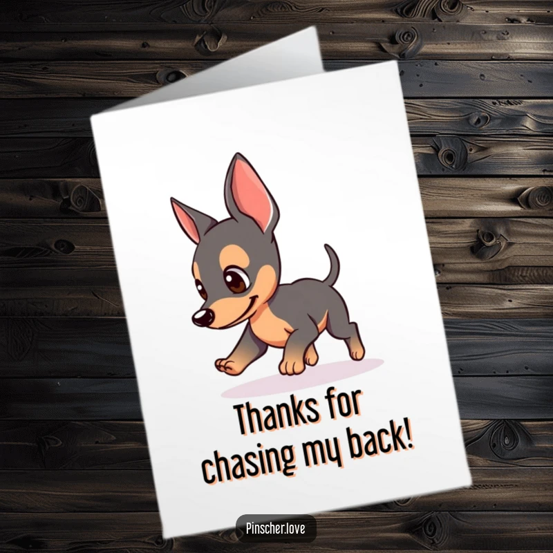 Funny Free Printable Thank You Card of a pinscher with perked ears, comically chasing its tail to express heartfelt thanks.