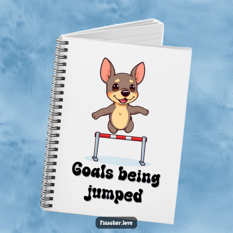 Funny Pinscher Notebook: A determined pinscher dog leaps over a tiny hurdle, ready to record your goals.