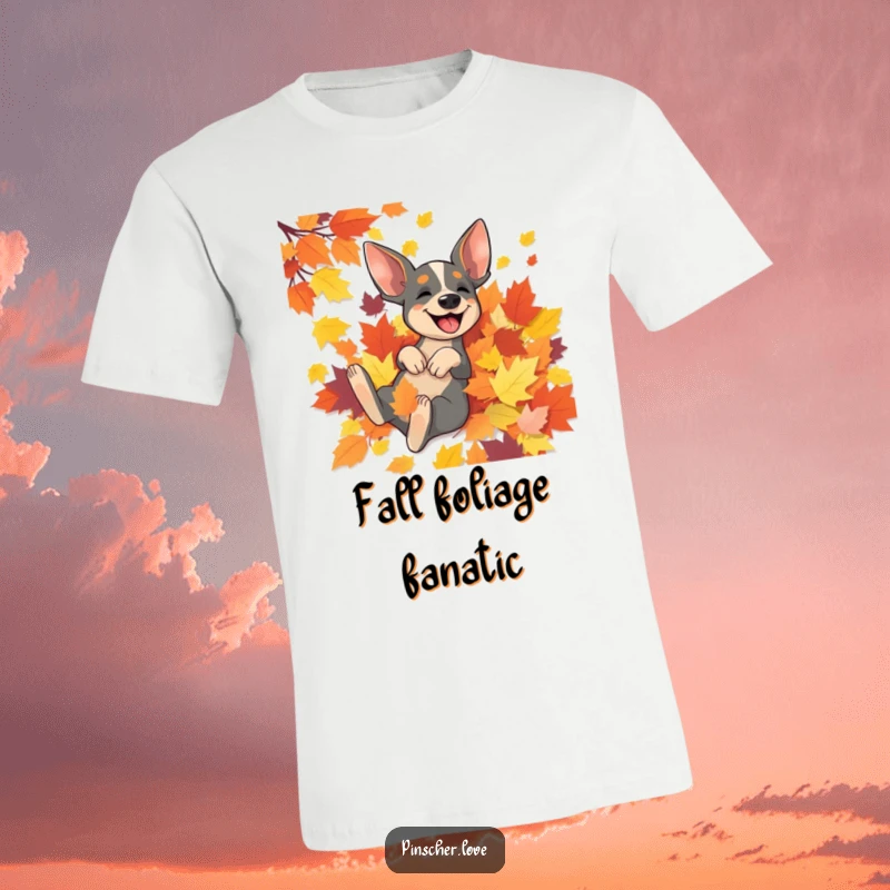 Funny Pinscher t-shirt with a joyous Pinscher dog rolling around in a large, colorful heap of autumn leaves.