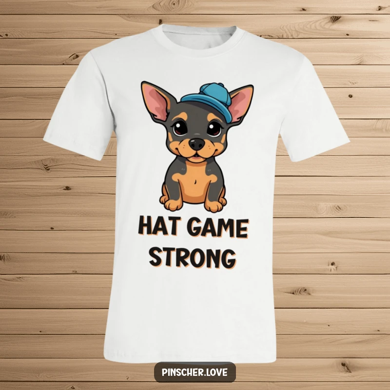 Funny t-shirt with a proud Pinscher posing, wearing a tiny, jaunty cap tilted jauntily to the side.