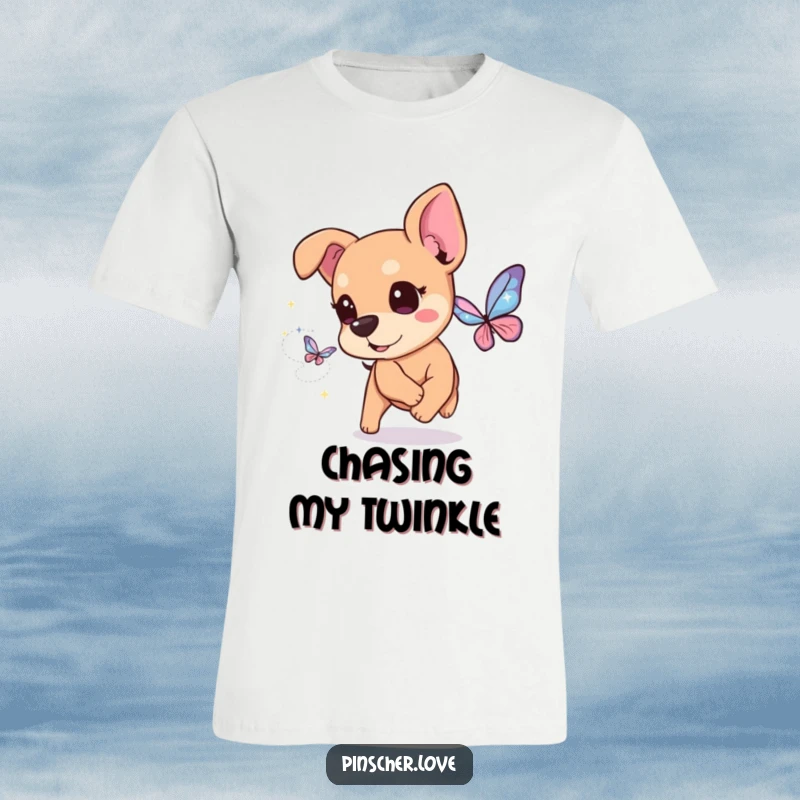 Funny Pinscher T-Shirt: A pinscher dog with bright, twinkling eyes enthusiastically chases a butterfly crafted from dazzling, magical sparkles.