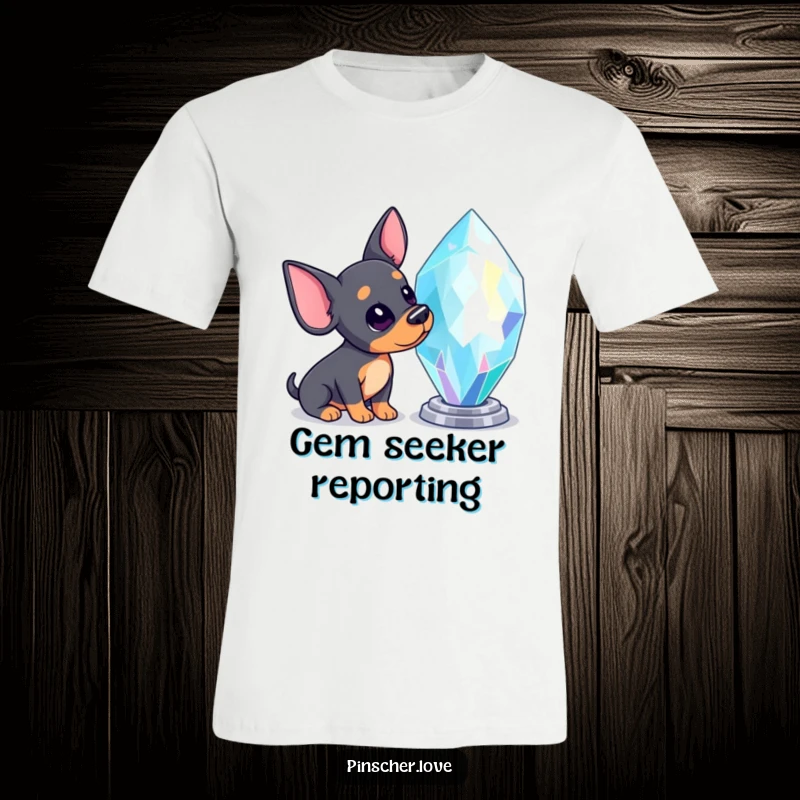 Funny Pinscher t-shirt featuring a Pinscher dog with its head tilted, captivated by a giant, dazzling, sparkling gem.