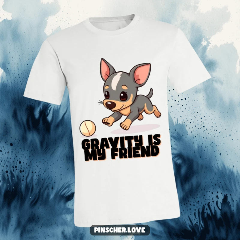 Funny Pinscher t-shirt, cute dog character stumbling while chasing a small ball, clumsy canine, great gag gift.