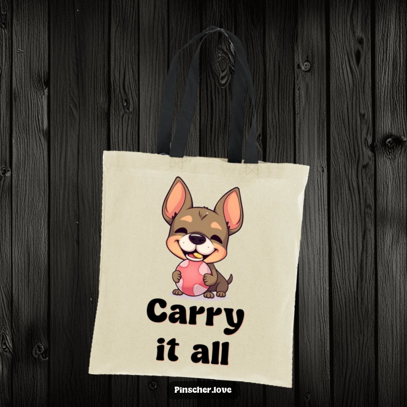 Funny Pinscher character tote bag, with a silly grin, balancing a ball on its nose, perfect for everyday use.