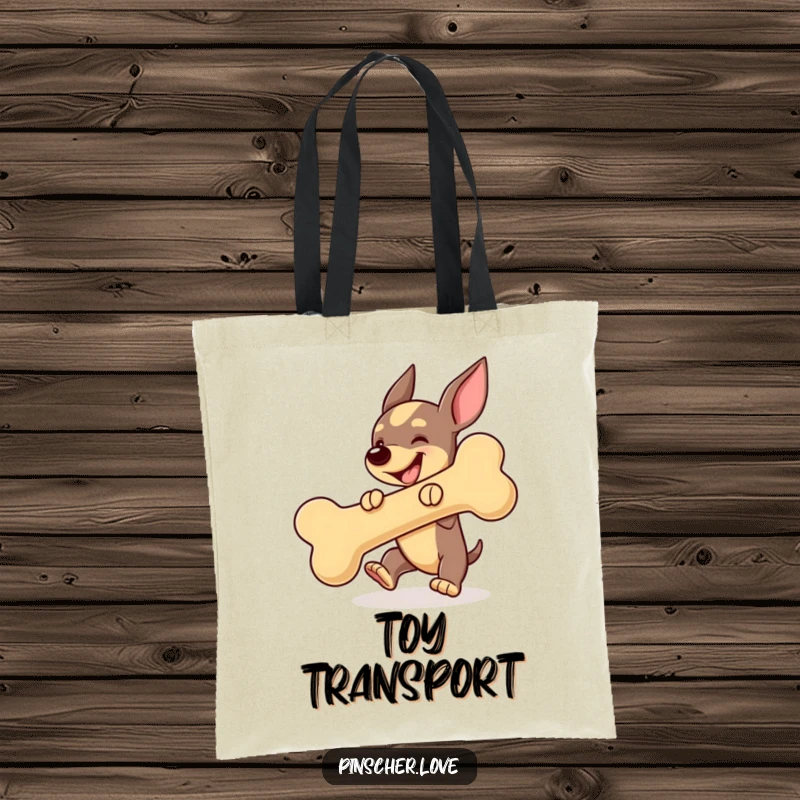 Funny Pinscher dog tote bag, actively bouncing a large squeaky bone, representing energetic play and happiness.